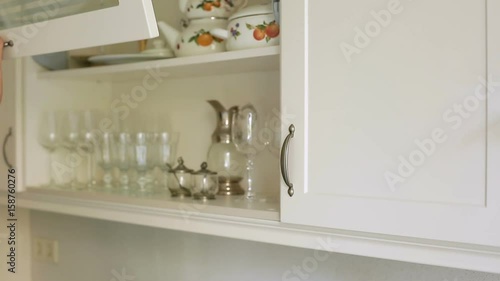 Footage of cupboards and built in modules in kitchen,Interior shot photo