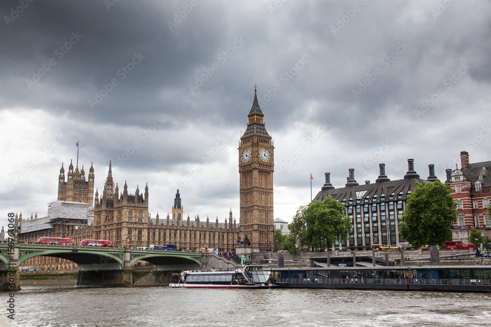 LONDON/UK - MAY 20 : Unidentified tourists travel on a sightseeing boat along the Thames, Big Ben and Westminster Bridge in the background LONDON/UK - MAY 20 : Unidentified tourists travel on a sightseeing boat along the Thames, Big Ben and Westminster Bridge in the background