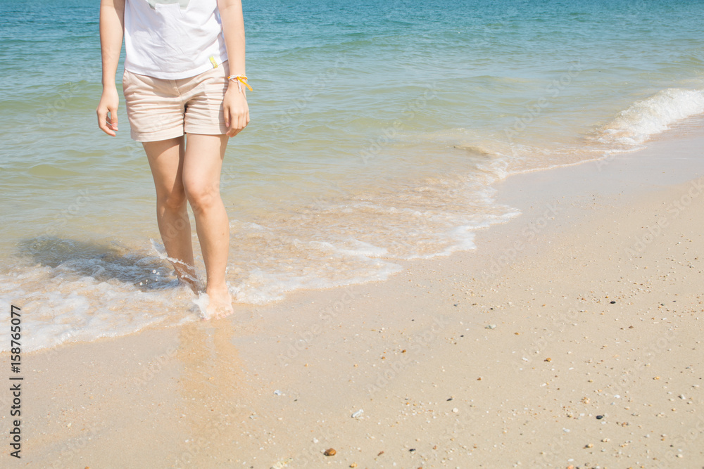 Woman walking on the beach Woman walking on the beach