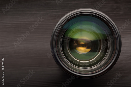 Camera lens close up isolated on dark background.