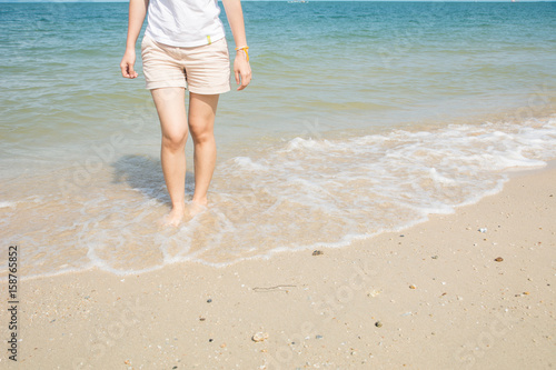 Woman walking on the beach