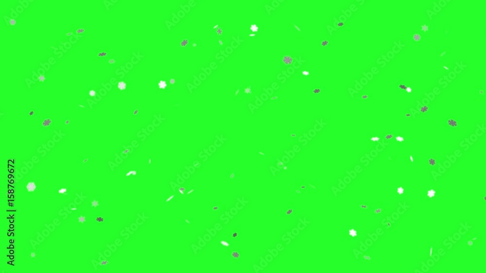 ornamental snowflakes falling against a green background ornamental snowflakes falling against a green background