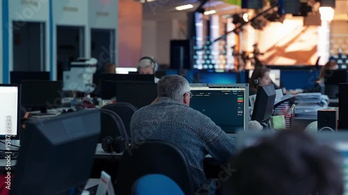 A man is working at a computer in the office