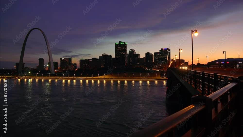 St Louis, Missouri cityscape skyline and Gateway Arch as night falls over downtown (logos blurred for commercial use) St Louis, Missouri cityscape skyline and Gateway Arch as night falls over downtown (logos blurred for commercial use)