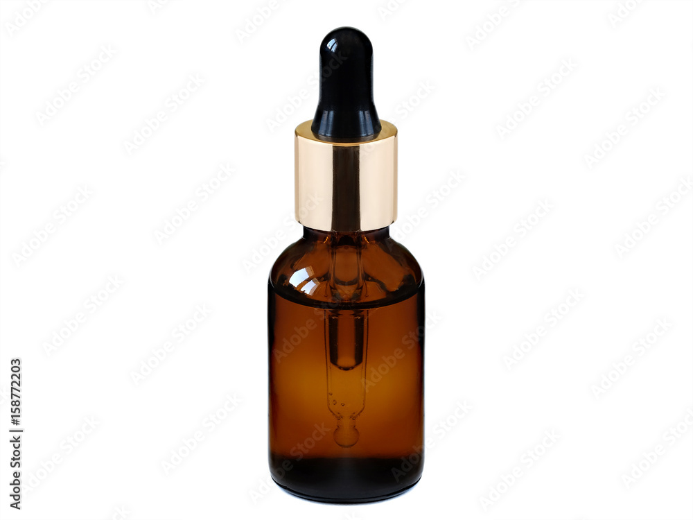 Glass bottle with pipette. Essential oil. Isolated on white background Glass bottle with pipette. Essential oil. Isolated on white background