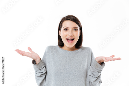 Fotografi Portrait of a happy excited girl holding copy space
