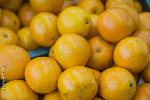 oranges fruit on market stall with chinese new year background  in market selective focus.