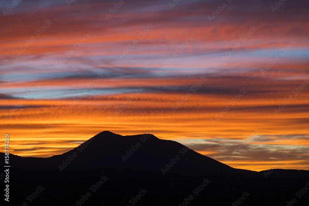 colorful sunset over a mountain in the desert 