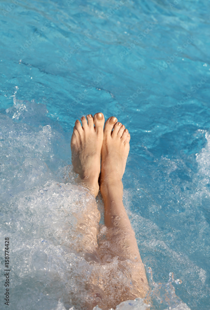 barefoot woman in the pool of the spa barefoot woman in the pool of the spa
