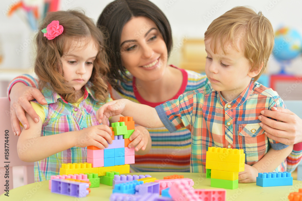 Mother playing with children