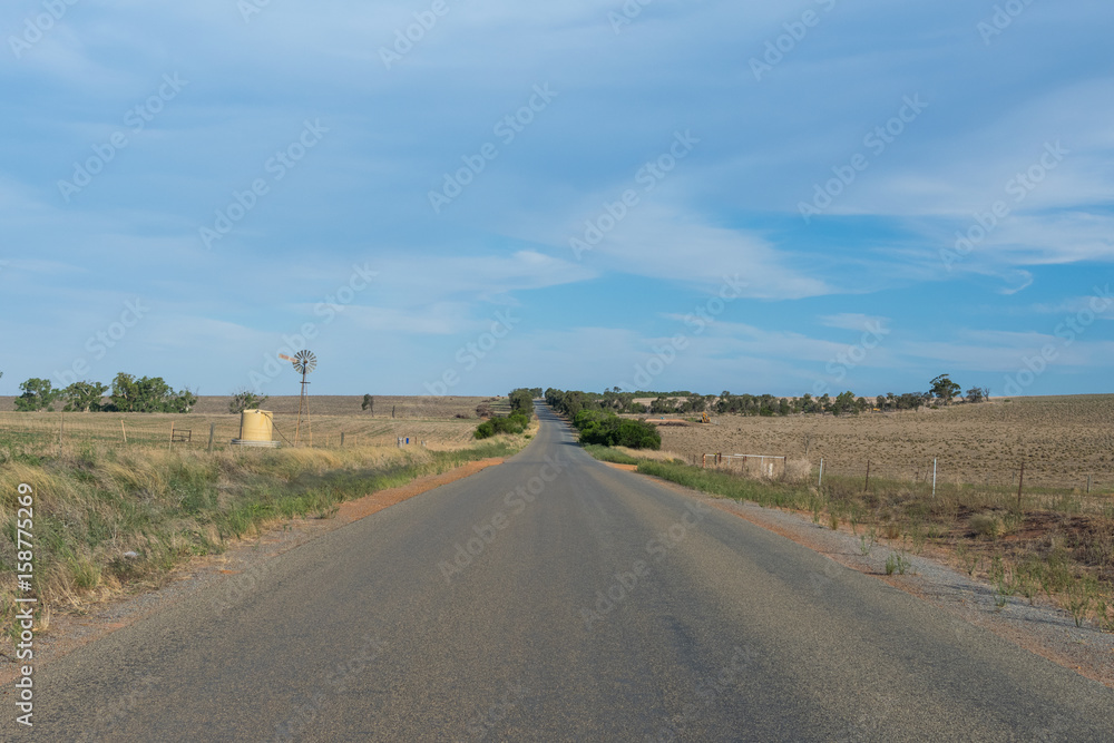 Milo road passing through open farming country