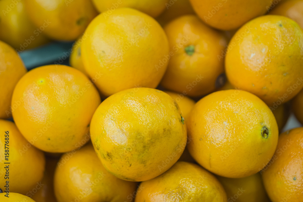 oranges fruit on market stall,with chinese new year background, in market,selective focus. oranges fruit on market stall,with chinese new year background, in market,selective focus.