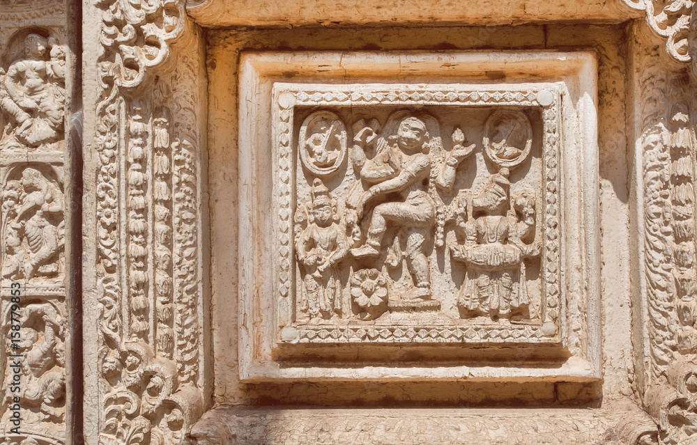 Dancing woman on Indian wood carvings on door of the Palace of Mysore, built in 1912 in India