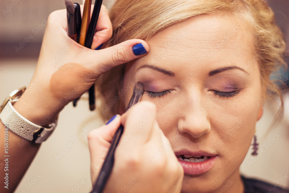 Bride's makeup on wedding day. Make-up before wedding ceremony. Bride's makeup on wedding day. Make-up before wedding ceremony.