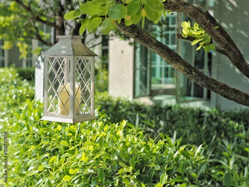 White vintage lantern decorate in the garden.