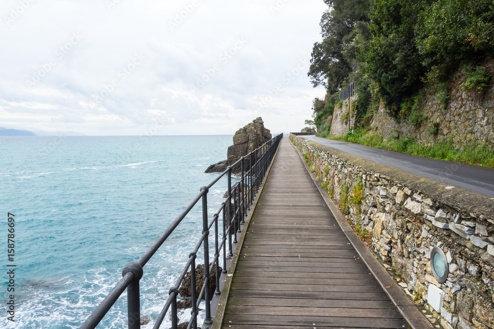 Rocks and the sea near Santa Margherita Ligure, Italy. A picturesque promenade, rocks and the sea