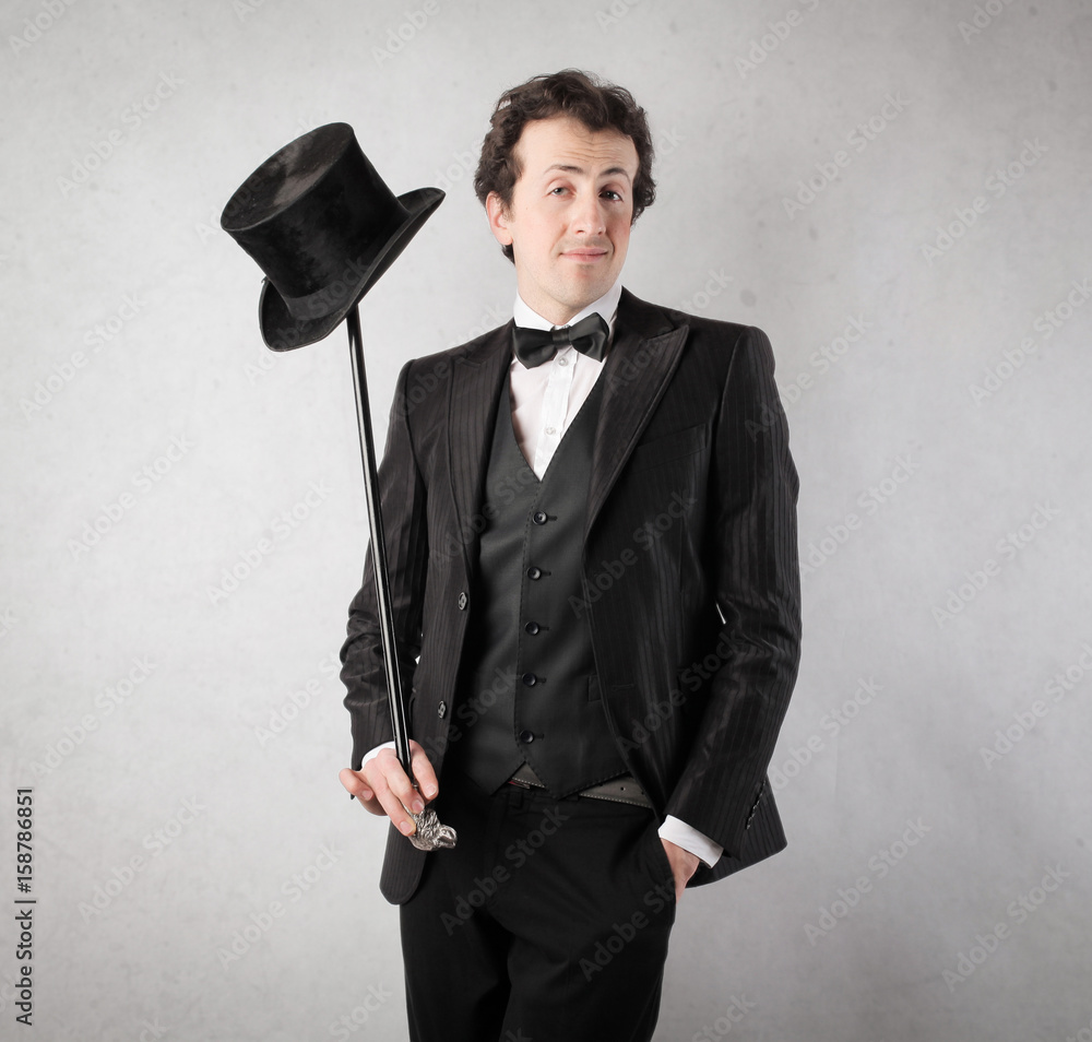 Wearing an elegant black suit StockFoto Adobe Stock