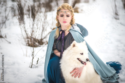 fantasy elf girl in spring forest with white dog laika © Sonya