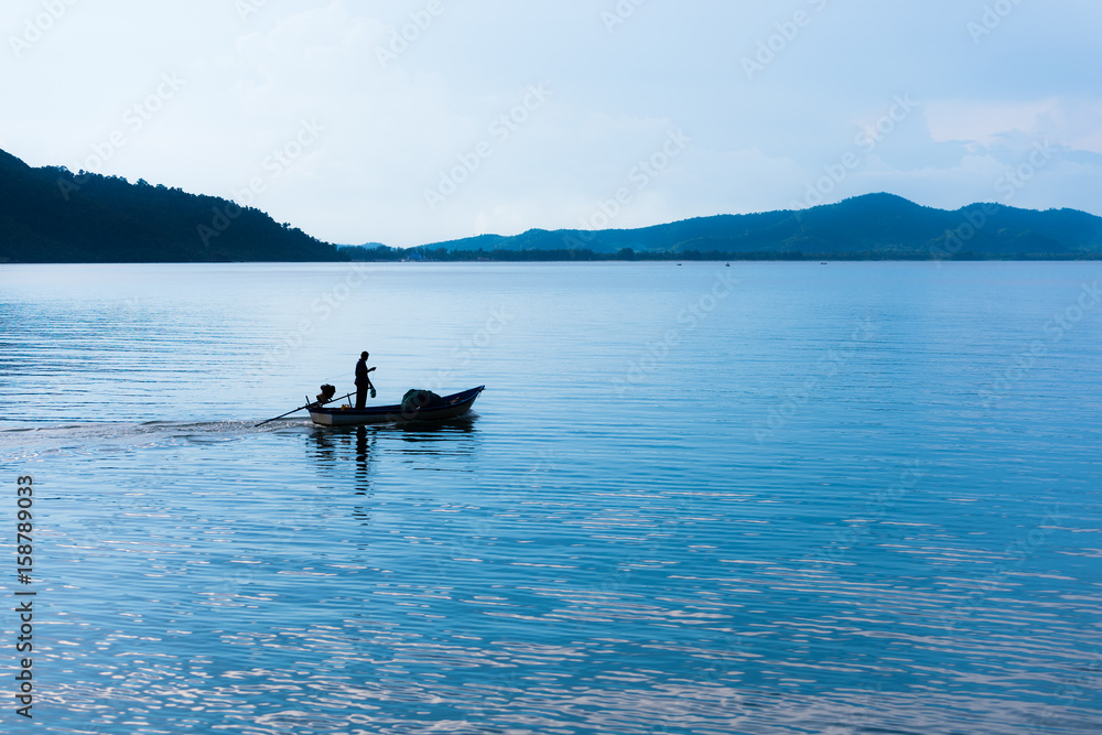 Floating fishing boat in the sea Floating fishing boat in the sea