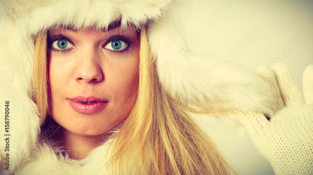 Blonde woman with fur cap. Blonde woman with fur cap.