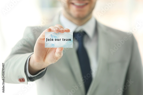 Young man holding business ...