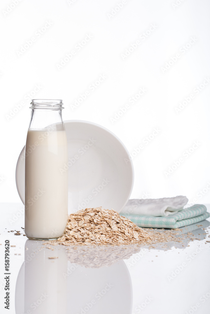 Flakes and milk on a white background Flakes and milk on a white background