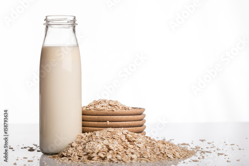 Flakes and milk on a white background