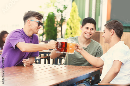 Guys drinking beer in pub