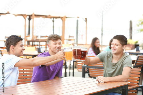 Guys drinking beer in pub