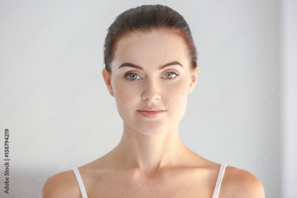 Portrait of beautiful girl on light background Portrait of beautiful girl on light background