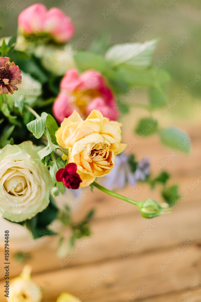 wedding, gardening, floral design, decoration, celebration concept - in beautiful wedding bouquet creamy avalanches and bright yellow roses stand out from other flowers wedding, gardening, floral design, decoration, celebration concept - in beautiful wedding bouquet creamy avalanches and bright yellow roses stand out from other flowers