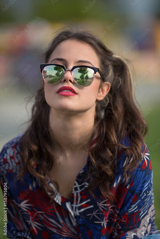 Portrait of pretty hipster girl wearing sunglasses Portrait of pretty hipster girl wearing sunglasses