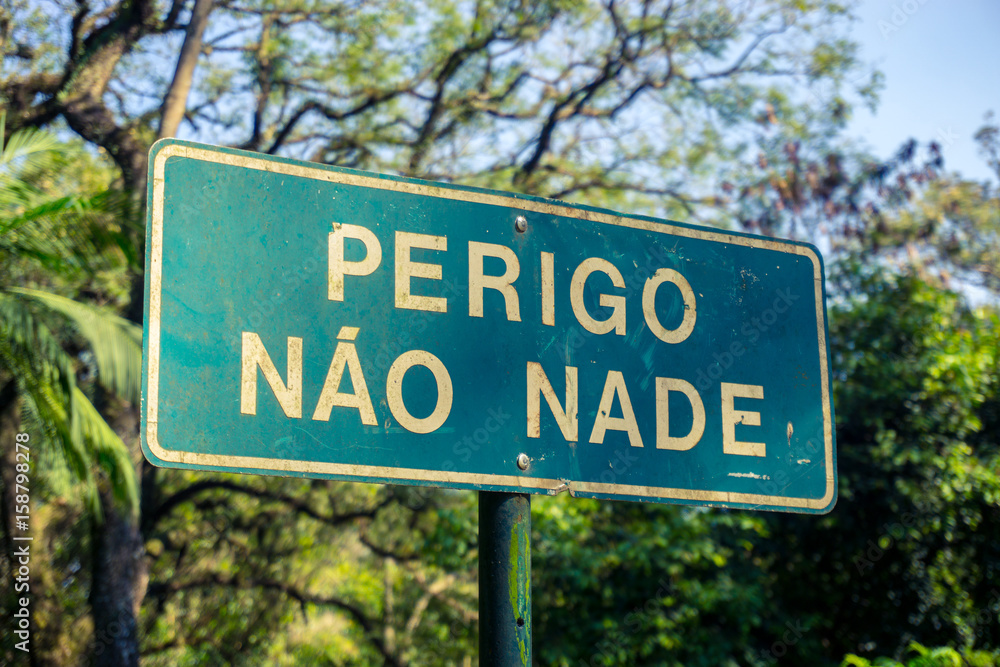 Plate - Danger Do not Swim - Park Ibirapuera, Sao Paulo, Brazil. Plate - Danger Do not Swim - Park Ibirapuera, Sao Paulo, Brazil.