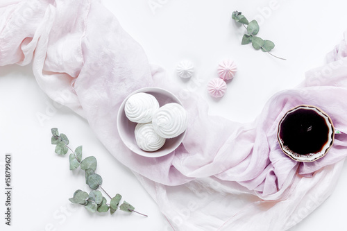 woman lunch with marsh-mallow  coffee and flowers soft light on white table background flat lay