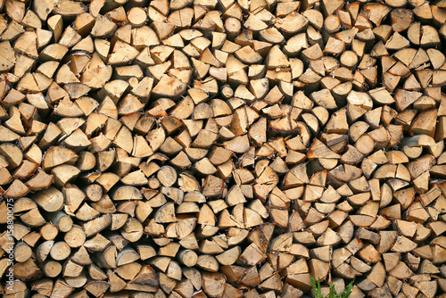 Stack of firewood. big pile of firewood for furnace, background.
