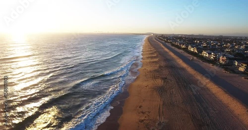 Vast beach in California at sunset, aerial
