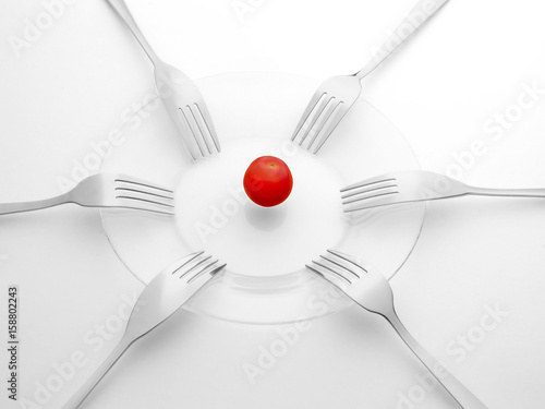 Canvas Print Red tomato and six black and white forks