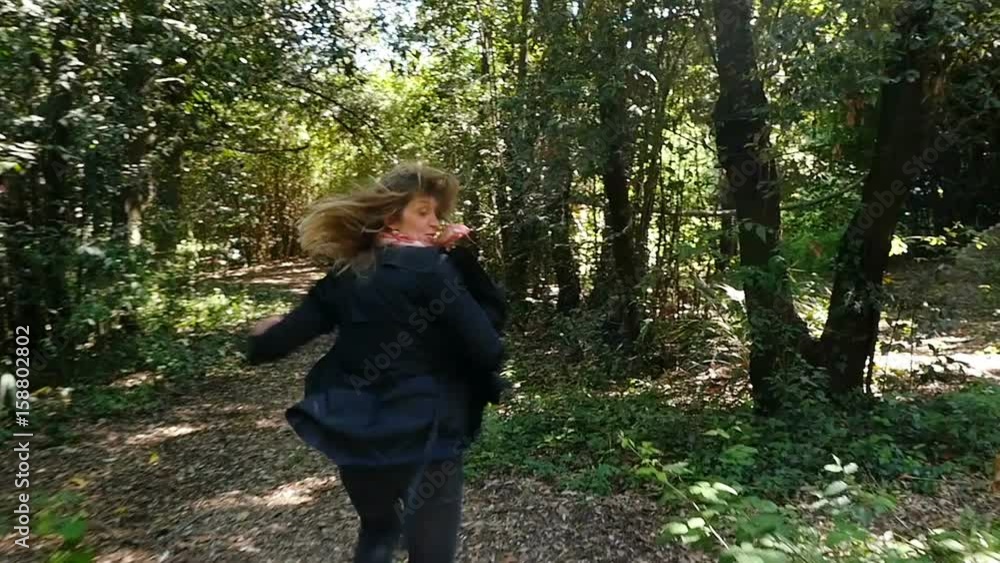 Scared terrified Woman Running Away From somebody Into Forest- slow motion Scared terrified Woman Running Away From somebody Into Forest- slow motion