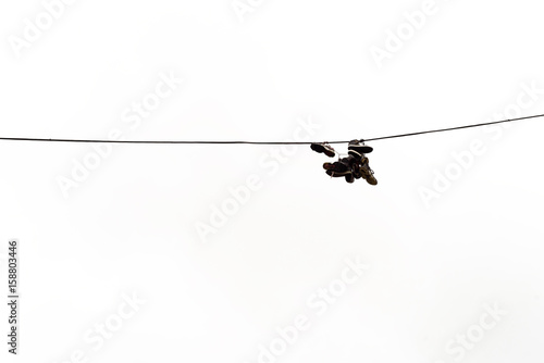 Boots Hanging on Electricty Cable