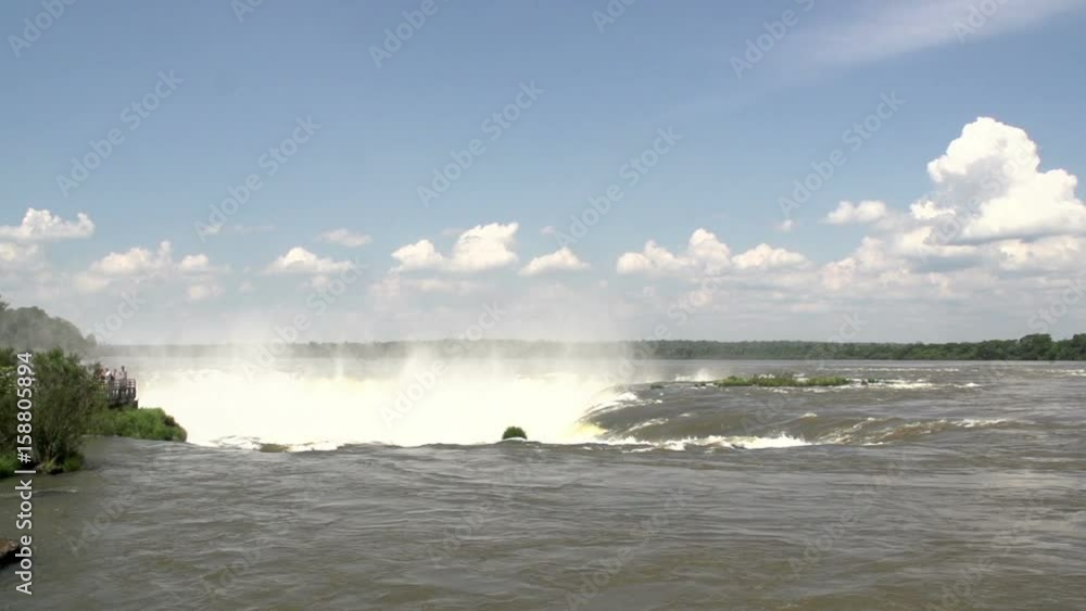People look at Iguazu falls People look at Iguazu falls