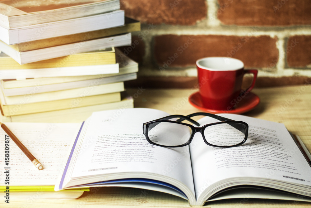 Fototapeta premium Reading glasses on the table