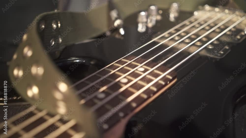 tracking shot of bass guitar
defocused strings tracking shot of bass guitar
defocused strings