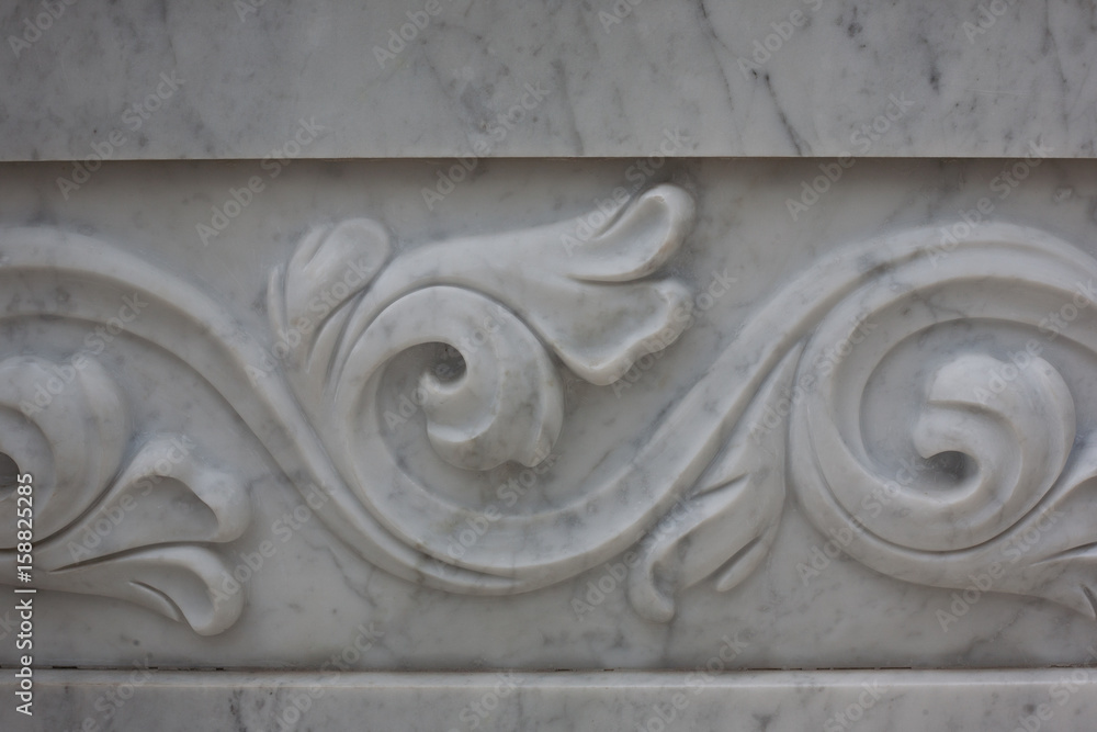 Naklejka premium Decorative pattern on a marble slab, background, texture. Fountain architecture.