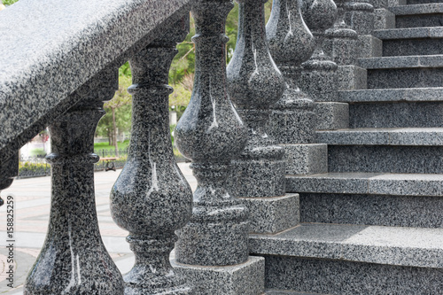 Granite ladder with figured handrail, granite stairs.