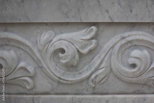 Decorative pattern on a marble slab, background, texture. Fountain architecture.