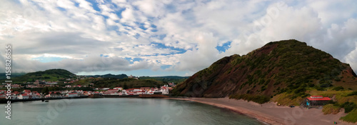 Sunset view to Horta, Porto Pim Bay and beach from mount Guia on Faial island, Azores, Portugal © homocosmicos