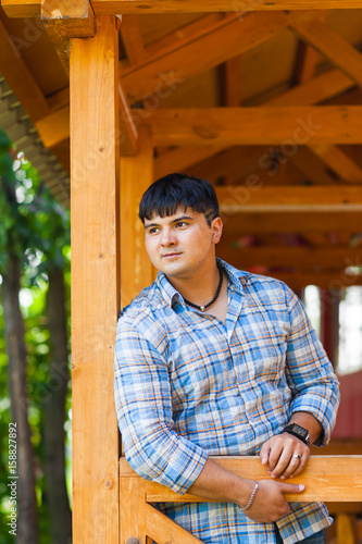 handsome mixed race young man smiling outdoors