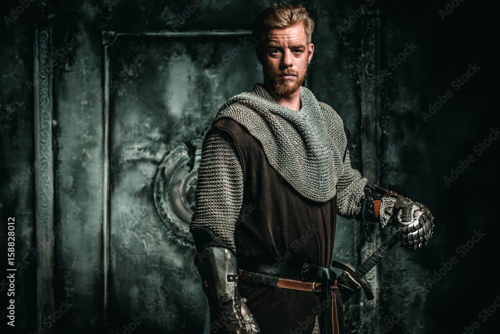 Naklejka premium Medieval knight with sword and armour