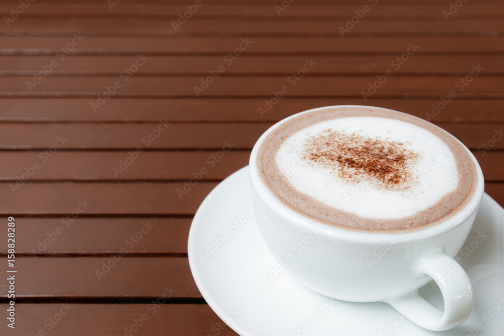 cup of hot chocolate with copy space on wooden table background cup of hot chocolate with copy space on wooden table background