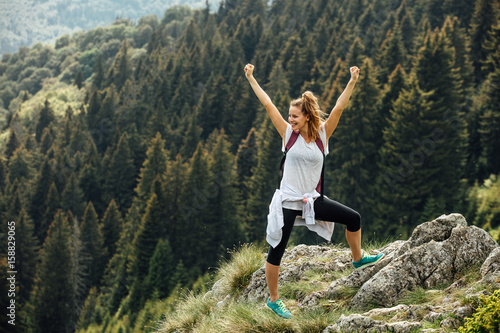 single woman on top of the mountains photo